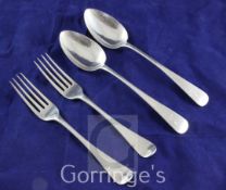 A pair of George III silver Old English pattern table spoons and a pair of George III silver