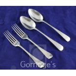 A pair of George III silver Old English pattern table spoons and a pair of George III silver