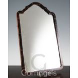 A small tortoiseshell framed wall mirror, with domed top, the plate 15 x 9in.