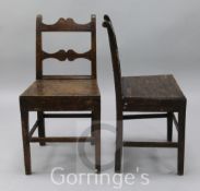 A pair of early 19th century oak wood seat dining chairs, with shaped spars and crest rails