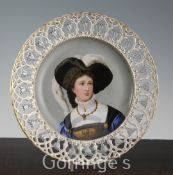 A French porcelain portrait dish, late 19th century, painted with a lady in Renaissance dress within