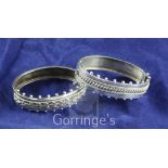 Two similar late Victorian silver hinged bracelets, with ropetwist and beaded decoration, both by