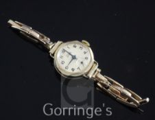 A lady's early 1960's 9ct gold Astral manual wind octagonal wrist watch, with Arabic dial and