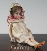 A small Simon & Halbig bisque headed doll, with composition jointed limbs and sleeping blue eyes,