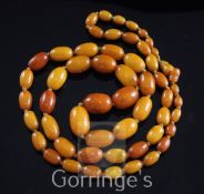 A single strand graduated oval amber bead necklace, gross weight 44 grams, 32in.