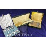 A cased set of twelve French plated teaspoons, a French silver handled cake slice and a cased set of