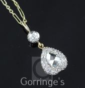 A Victorian style gold and diamond inverted heart shape pendant necklace, with central rose cut