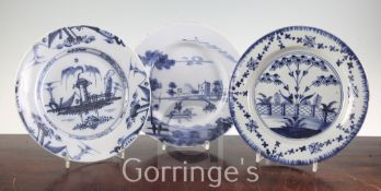 Three English delft ware plates, c.1760-70, the first painted with a European scene of boats on a
