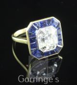 A mid 20th century gold, asscher cut diamond and sapphire set dress ring, the central diamond with