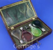 A 19th century French brass mounted mahogany cased set of four silver mounted teardrop shaped