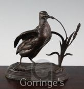 After Jules Moigniez (1835-1894). A brown patinated bronze model of a partridge eating millet,