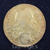 A Charles II gold guinea, 1668, near VF, with attractive toning