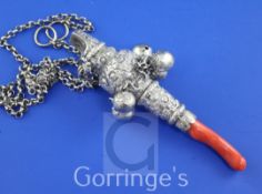 A George IV silver baby's rattle, with whistle, five (ex 6) bells and coral teether, with repousse