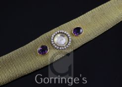 A lady's stylish 1960's 18ct gold, amethyst and diamond Zenith dress bracelet watch, the circular