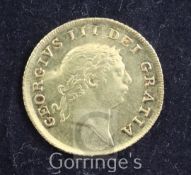 A George III gold half guinea, 1804, creased otherwise VF
