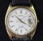 A gentleman's 1950's/1960's 18ct gold Rolex Oyster Perpetual wrist watch, with milled bezel and