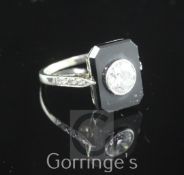 A 1930's/1940's 18ct white gold, onyx and single stone diamond tablet ring, of octagonal form,