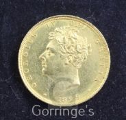 A George IV gold sovereign, 1829, occasional nicks, edge dents otherwise EF,