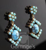 A pair of gold and turquoise set cluster drop earrings, with central cabochon stone and arrow