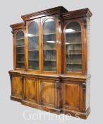 A good Victorian pollard oak breakfront library bookcase, with moulded cornice and four arched