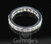 A white gold and diamond full eternity ring, set with twenty three round old cut stones, size O.