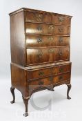 An early 18th century walnut chest on stand, with moulded top, two short and three graduated long