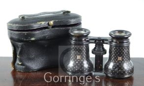 A pair of Victorian tortoiseshell pique opera glasses, in original leather case, retailed by
