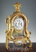A mid 18th century German carved giltwood striking and chiming mantel clock, with enamelled Roman