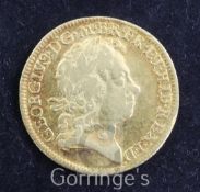 A George I gold guinea, 1716, near VF, toned