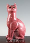 After Louis Wain. A Weymss pink glazed model of a seated cat, with green glass insert eyes,