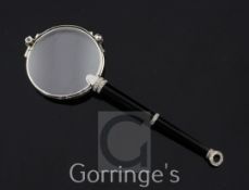A pair of 1920's/1930's French platinum, onyx and diamond set lorgnettes, with tapering handle,