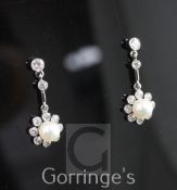 A pair of early 20th century white gold, cultured pearl and diamond cluster drop earrings, of flower