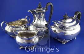 An Edwardian four piece silver tea set, of oval form, comprising teapot, cream, sugar and hot