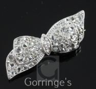 A white gold and rose cut diamond set ribbon bow brooch, with an estimated total diamond weight of