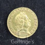 A George I gold quarter guinea, 1718, Good VF, toned