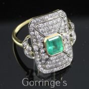 A mid 20th century Belle Epoque style gold, emerald and diamond tablet ring, of octagonal form, with