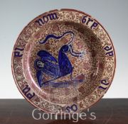 A Hispano-Moresque copper lustre and blue decorated charger, probably Manises 18th century, the