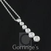 A modern Tiffany & Co Jazz platinum and diamond drop pendant necklace, with six collet set graduated