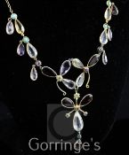 An early to mid 20th century gold and silver multi gem set drop necklace, set with cabochon