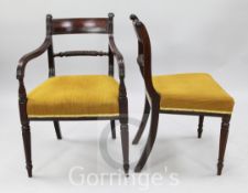 A set of eight Regency mahogany dining chairs, including two carvers, with tablet cresting rails,