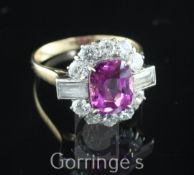 A 1940's/1950's 18ct gold, pink sapphire and diamond oval cluster ring, the central oval cut