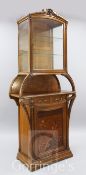 A Louis Majorelle 'Chicoree' pattern oak and marquetry display cabinet, with bevelled glazed door