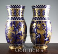 A pair of large Coalport Japanese Grove pattern Aesthetic period vases, c.1885, on a gilt ground,
