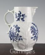 A Worcester Natural Sprays Group pattern blue and white mask jug, c.1765-70, with leaf moulded body,