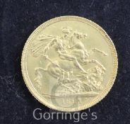 A George IV gold sovereign, 1821, occasional nicks, edge dents otherwise EF,