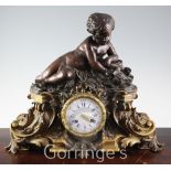 Joseph Silvani of Paris. A mid 19th century French bronze and ormolu mantel clock, surmounted with a
