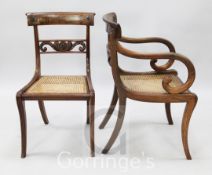 A set of eight Regency mahogany dining chairs, including two carvers, with roundel carved tablet