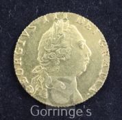 A George III gold guinea, 1793, Good VF