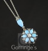 A late Victorian gold, silver, turquoise and diamond drop pendant, of flower head design and set