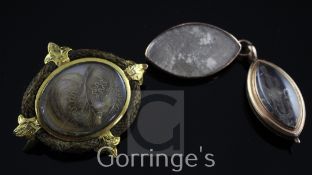 Two 19th century gold mounted mourning brooches, of oval form with engraved initials and glazed